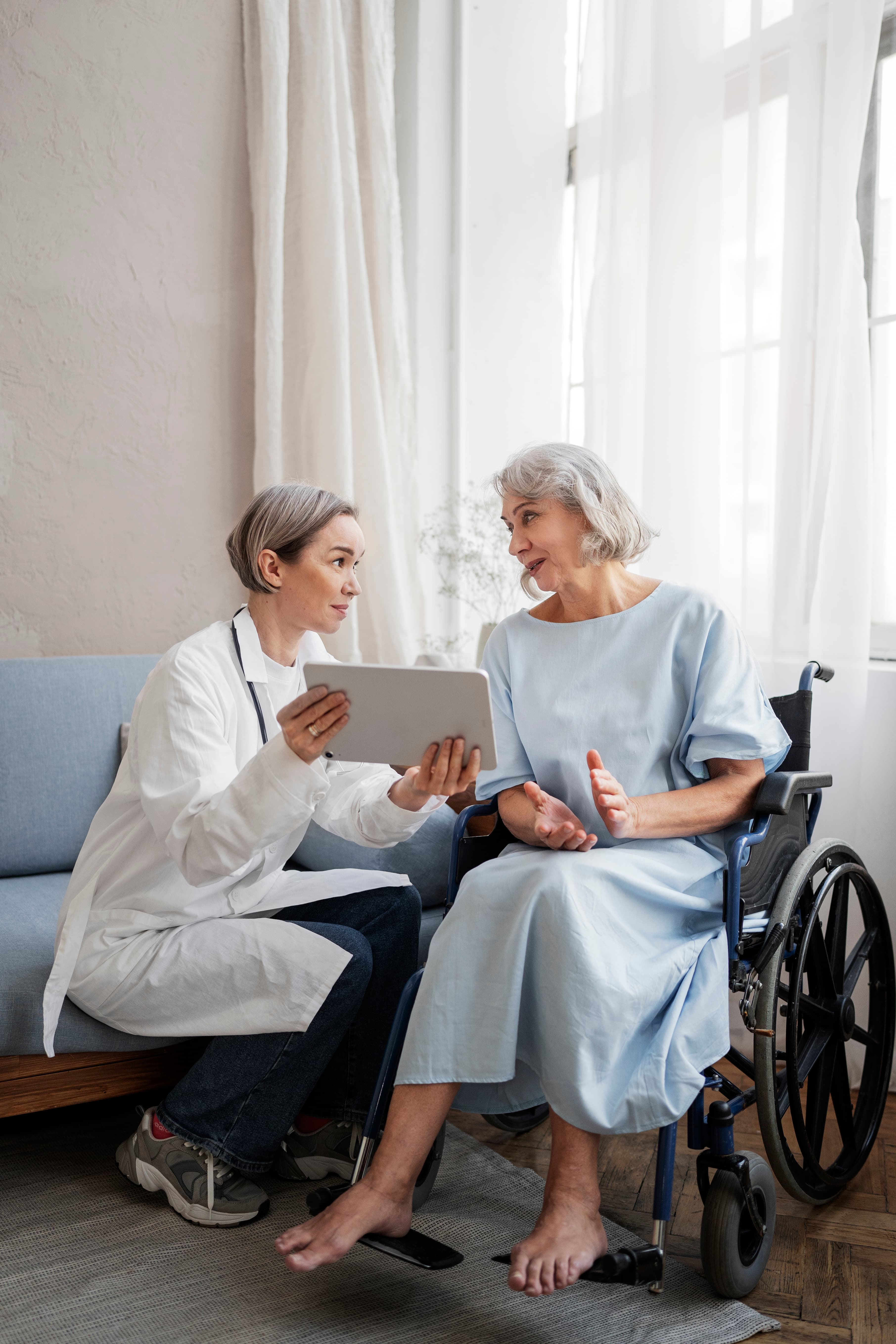 Old patient suffering from Parkinson being consulted